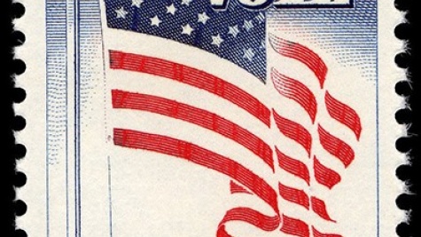 US stamp with an American Flag image. Reads "Register, Vote" 5 cents postage.