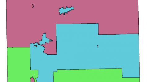 A districting map shows three districts that roughly divide a square into three, block polygon parts, each a different color. Notably, there are two district "islands" that are surrounded on all sides by one or both of the other districts