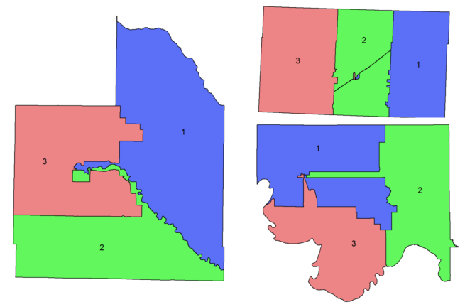 Three Oklahoma county district maps, each divided into three districts. Woodward Cty on the left has one vertical rhombus commission district (D1) that is roughly the size of the other two. D3 sits atop D2. A snake-like thread of D2 and D1 cut into the middle of D3. The Texas Cty map is draw into 3 vertical rectangles. A tiny dot in the middle of D2 has "islands" of D1 and D3. The Jefferson Cty map also shows 3 districts that are approx. same size, but long lines and irregular shapes of D2/D3 cut into D1